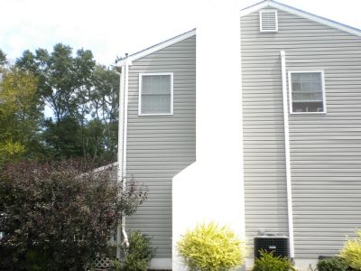 External Radon Remediation System on Side of House by Radon-Rid, LLC