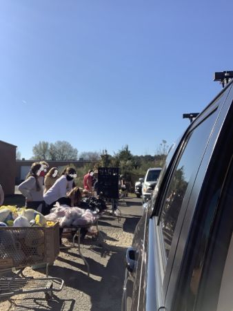 Cars lined up to  get loaded with food for delivery at The Great Turkey Countdown of 2020 | VIEWS Digital Marketing Community Service