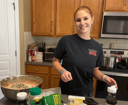 Mary's Daughter with ingredients for ziti | VIEWS Digital Marketing