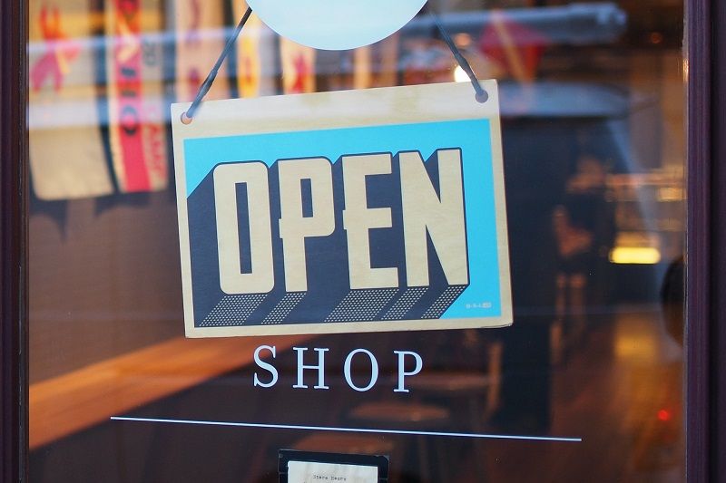 Store with open sign on door | local boosting | VIEWS Digital Marketing