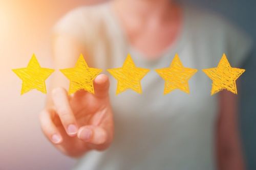 Businesswoman rating with hand drawn stars | online reputation management | VIEWS Digital Marketing