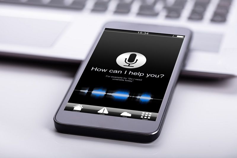 Smart phone on desk with voice search enabled | voice search | VIEWS Digital Marketing