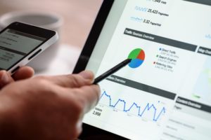 Person with pen pointing at Google Analytics on laptop | top seo company in pennsylvania | VIEWS Digital Marketing