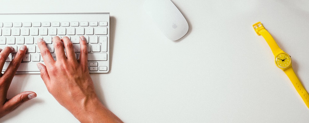 Person at Mac computer typing | certifications in digital marketing | VIEWS Digital Marketing