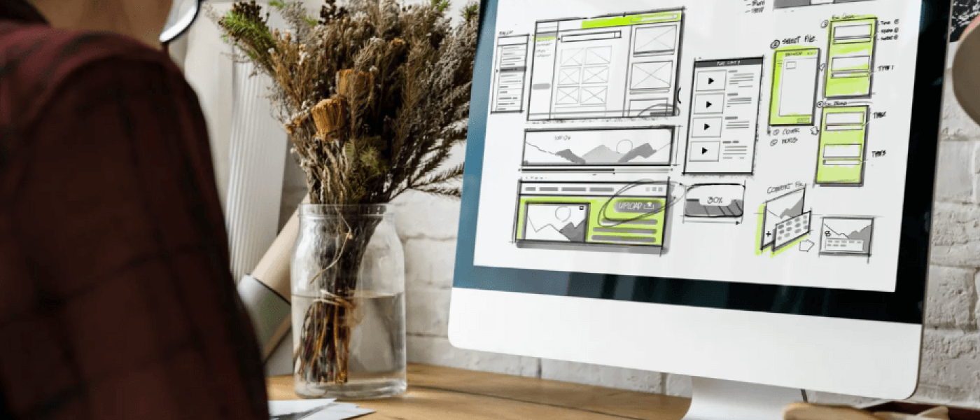 Person designing website on computer | website redesign for small business | VIEWS Digital Marketing