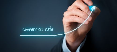 Hand with conversion rate line graph | website design company | VIEWS Digital Marketing