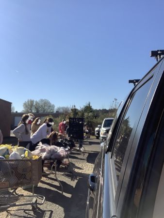 Cars lined up to get loaded with food for delivery at The Great Turkey Countdown of 2020 | VIEWS Digital Marketing Community Service